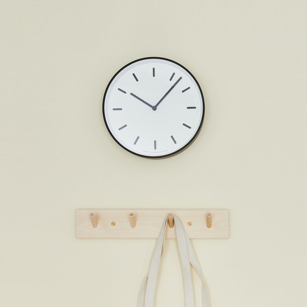 Graphic wall clock with coat hooks