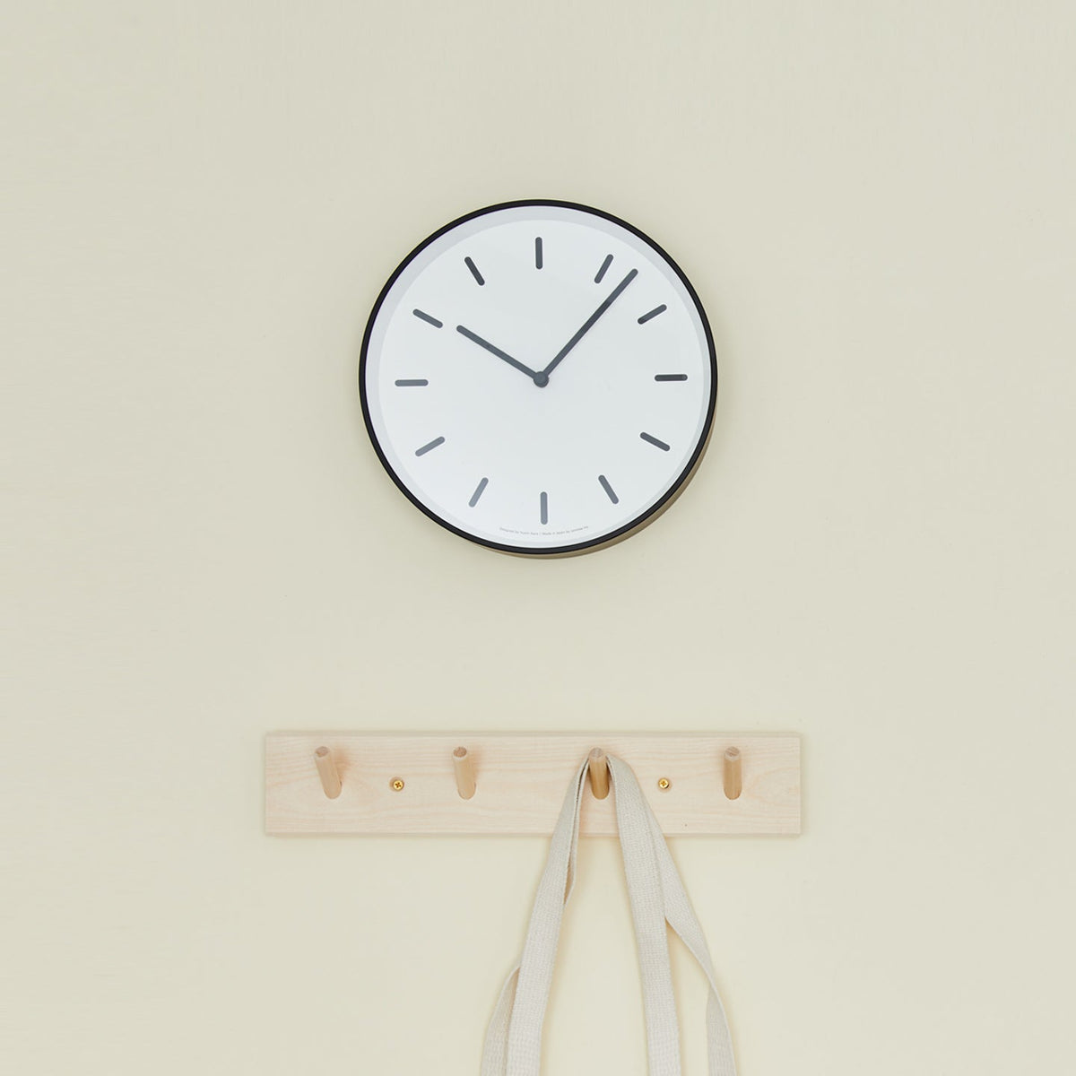 Graphic wall clock with coat hooks