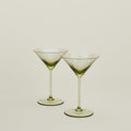 Set of two ribbed olive martini glasses.
