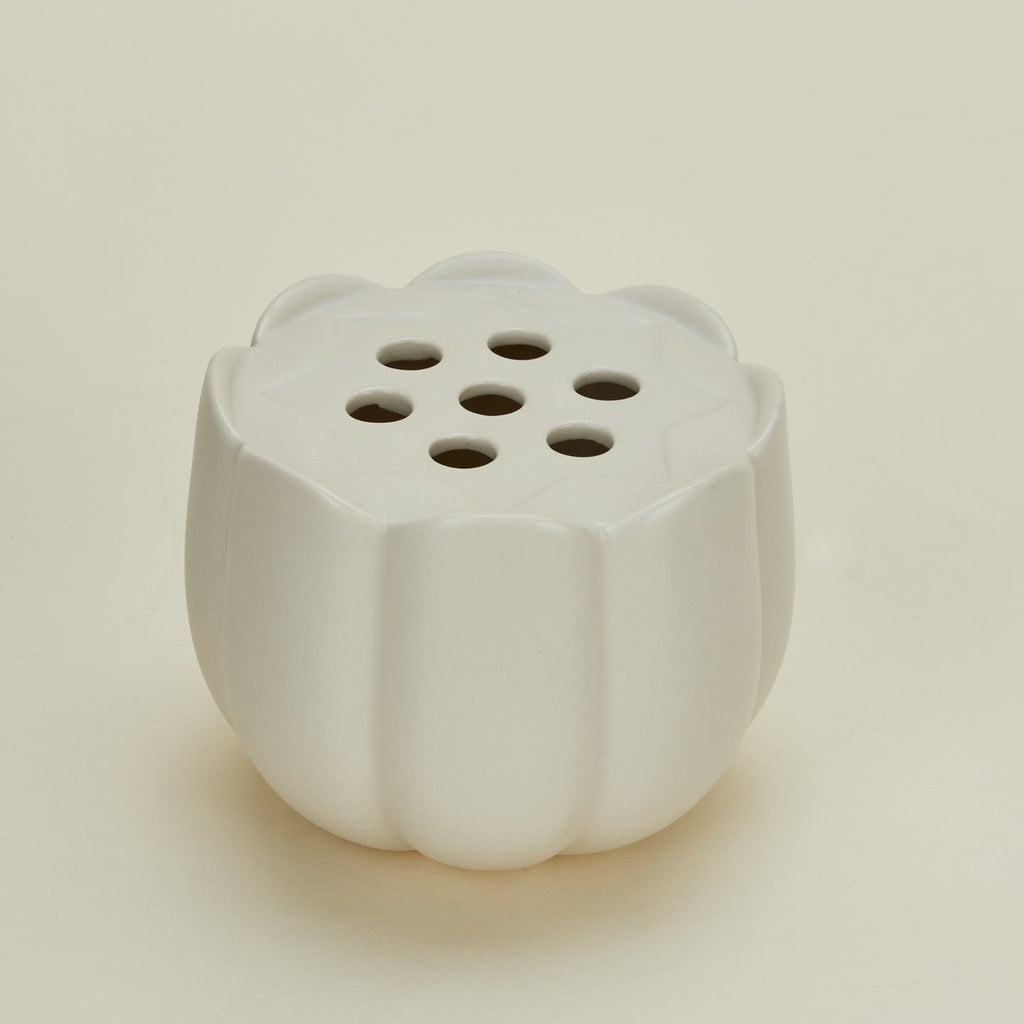 Detailed view of Floral Society flower frog vase