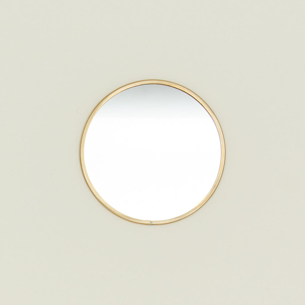 Round brass mirror.