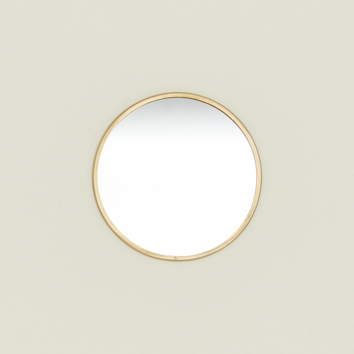 Round brass mirror.